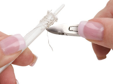 Cutting the extra length off with small cutters